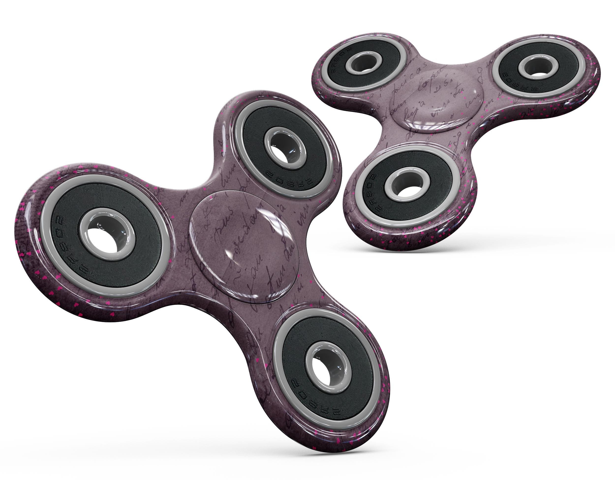 Purple fidget spinners with bearings.